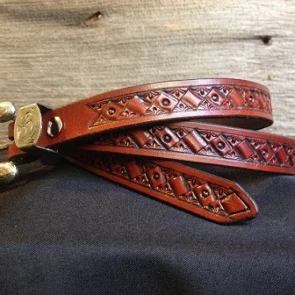 3/4" wide USA Veg tanned leather. Hand-tooled, dyed and finished with a Montana Silver Smiths Raised Berry Two Tone Buckle. Chicago screws allow the buckle to be changed. Sized to fit 38" on the center hole. $135 SOLD